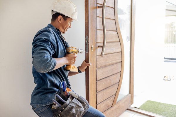 Locksmith, man and maintenance, handyman with home renovation and fixing, change door locks with po.